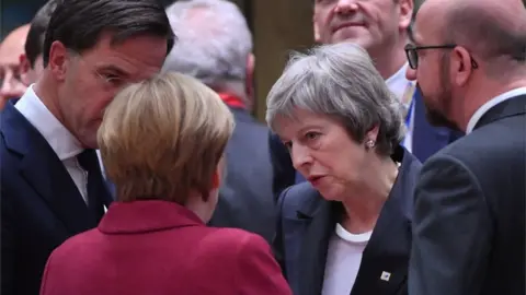 AFPp Theresa May talks with EU leaders at the summit