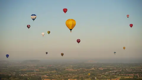 PA Media Hot air balloons in the sky