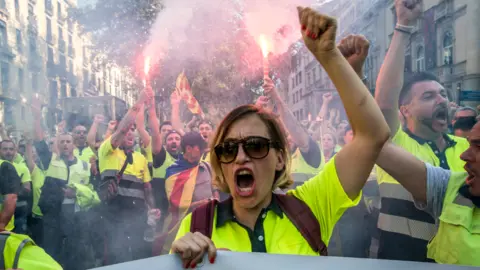 Getty Images Demonstrators on the streets of Barcelona protest against police violence following the Catalan independence referendum, 3 October 2017