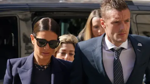 Yui Mok/PA Rebekah Vardy arriving at court with her husband Jamie