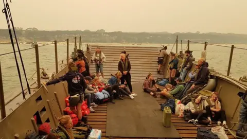 Fran Lawson Evacuees were taken from the shore to larger ships