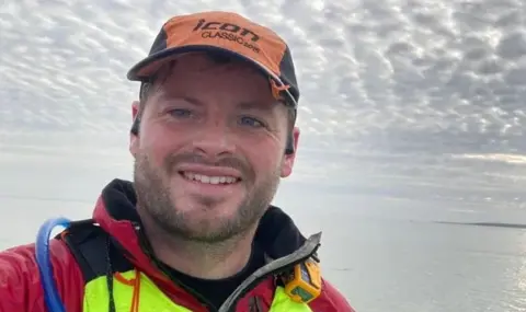 Mike Lambert taking a selfie in his kayak gear 