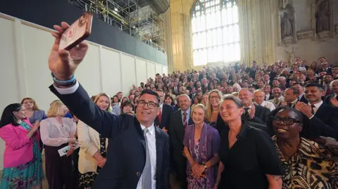 PA Media Andy Burnham MP takes a selfie with about 200 colleagues from the Parliamentary Labour Party in Westminster Hall at the Houses of Parliament.