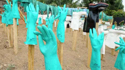 A view of gloves and boots used by medical staff, drying in the sun, at a centre for victims of the Ebola virus in Guekedou, on April 1, 2014.