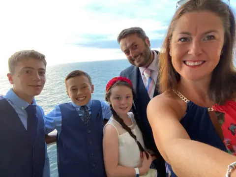 Family photo Zach, his sons, Anna and Elizabeth