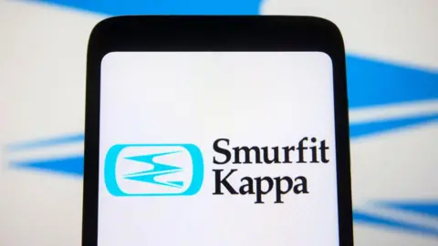 SOPA Images/Getty Images A phone displaying the Smurfit Kappa logo