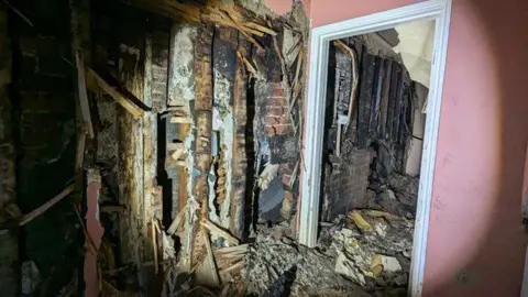 Helen Langford The ruined inside of a house on Northgate Street in Devizes, following a fire at the adjoining kebab shop.