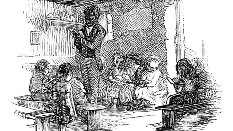 Getty Images An etching of a black man standing with a book, surrounded by seated children
