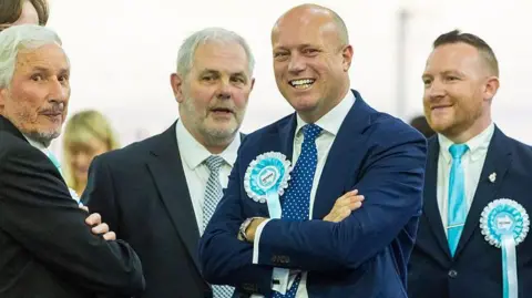 Getty Images Dan Thomas, Leader of Reform in Wales visits the Casnewydd Islwyn Senedd constituency vote count, at the Geraint Thomas National Velodrome, Newport. The 2026 Senedd election marks a major overhaul of the Welsh Parliament as the number of Members increases from 60 to 96. Under a new proportional system, voters cast a single vote for a party list across 16 new constituencies, each electing six representatives. 