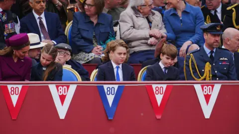 PA Media Princess Charlotte, Prince George, Prince Louis and the Prince of Wales ahead of the military procession