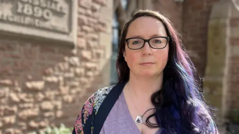 Deputy Louise Doublet is pictured outside St Saviour parish hall. 