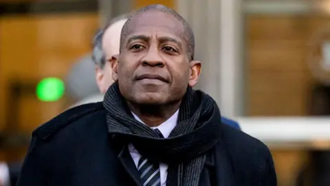 Getty Images Carlos Watson, co-founder and chief executive officer of Ozy Media Inc., exits federal court in the Brooklyn borough of New York, US, on Friday, 13 December, 2024.