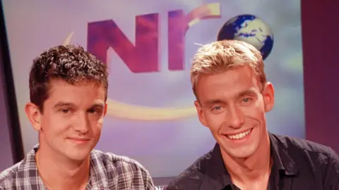 Archive shot of Newsround presenters Matthew Price and David Bull
