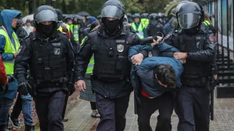 Reuters Russian police detain a protester