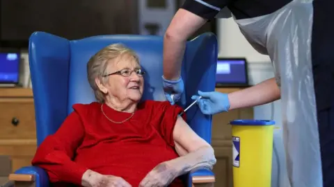 Getty Images elderly woman given vaccine