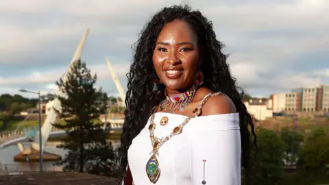 Lilian Seenoi-Barr with the Peace Bridge in the background