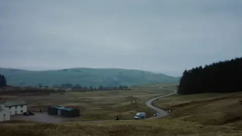 Sky A winding road cuts through rolling countryside in the Welsh countryside near Builth Wells in Powys