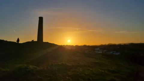 A hill with a monument on it.