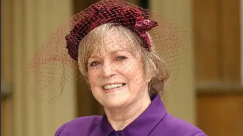 Author Dame Shirley Conran after receiving an OBE for services to equal opportunities from the Prince of Wale