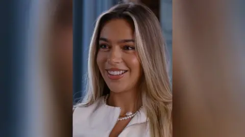 Young woman with fair hair smiles