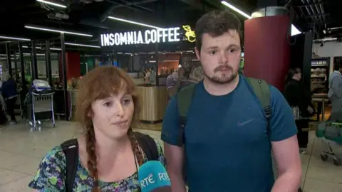 RTÉ Young man and woman at Dublin Airport