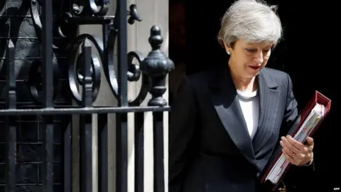 AFP Theresa May leaving Downing Street