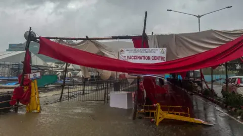 Getty Images A structure at a vaccination centre in Mumbai city collapsed due to Cyclone Tauktae on 17 May