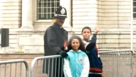 Ceri Hassan Derrick with his children at the European summit in Cardiff in 1998