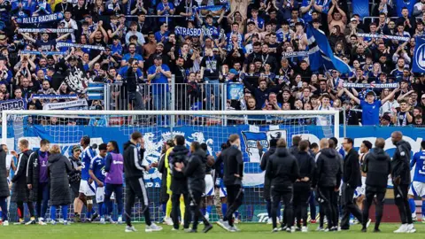 Strasbourg supporters celebrate with their team