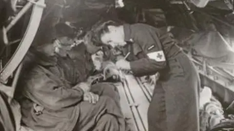 Air Ambulance Nurses A nurse treating soldiers