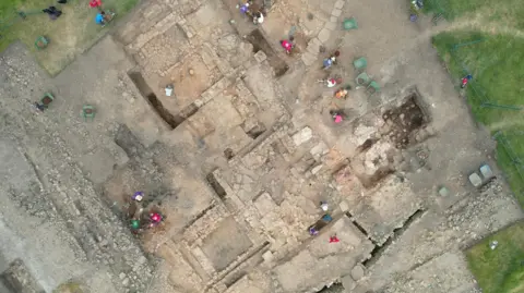 The Vindolanda Trust An aerial view of the Magna trench excavations at the Magna Roman Fort in Northumberland