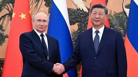 Vladimir Putin and Xi Jinping shake hands, with the flags of Russia and China in the background
