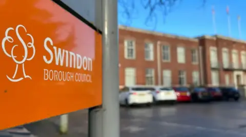 Orange sign outside Swindon Borough Council 