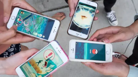 PG/Bauer-Griffin Pokemon Go players are seen in search of Pokemon and other in game items in Pasadena Playhouse District during PokeNight on July 27, 2016 in Pasadena, California.