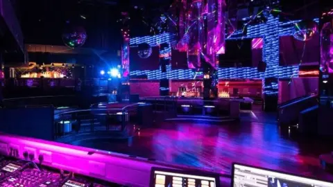 Getty Images A technician in PRYZM nightclub in Birmingham, poses for a photograph in the closed superclub