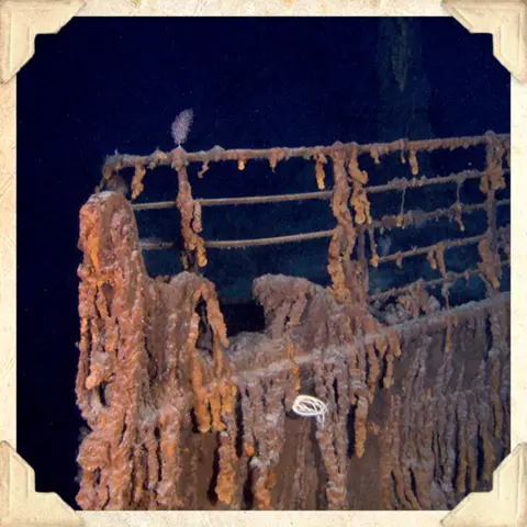 A photograph of the wreck of the Titanic showing the famous bow at the front of the ship under the sea (Photo RMS Titanic Inc)