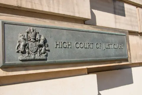 A metal sign outside the High Court in Edinburgh