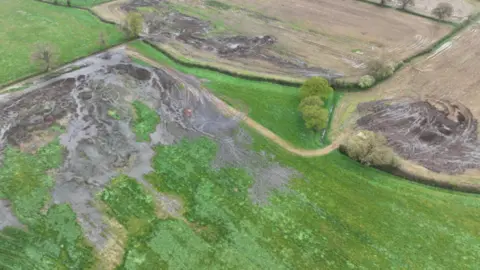 Environment Agency Several fields with slurry spread across them.