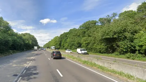 Oxford's Eastern Bypass is a dual carriageway bordered on both sides by trees in this image