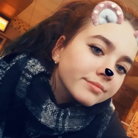 Karin Gross Instagram picture of Keira with cat ears and nose