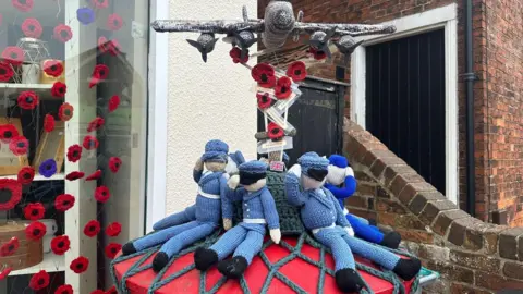 Laura Hammond/BBC A postbox topper in tribute to those who died in the Halifax bomber crash