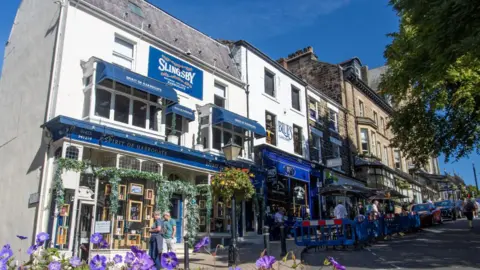 Getty Images Spirit of Harrogate shop with Slingsby Gin logo at top of building.
