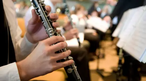 Getty Images Someone playing a clarinet