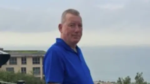 Leicestershire Police A man in a blue polo shirt