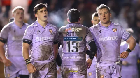 Gloucester players, wearing the Prem club's mauve away kit, react after being beaten 45-14 at Leicester Tigers