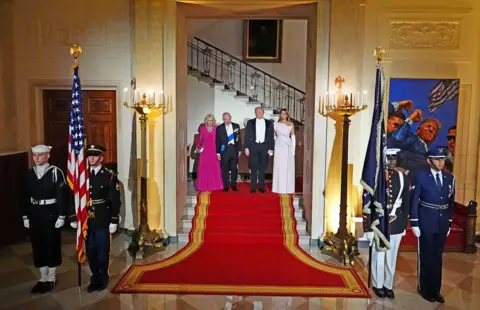 PA Media Queen Camilla, King Charles III, President Donald Trump and First Lady Melania Trump pose in the Grand Foyer ahead of the State Dinner at the White House