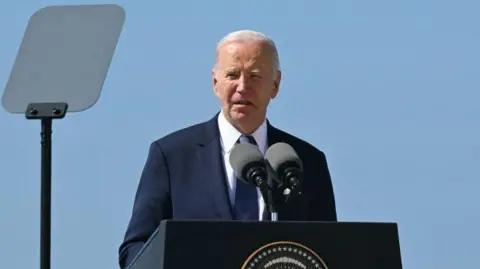 US President Joe Biden delivers a speech near the monument on "Pointe du Hoc" clifftop in Cricqueville-en-Bessin, north-western France, on 7 June 2024