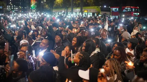 PA Media Thousands attend the vigil