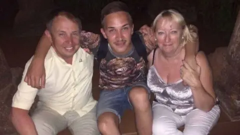 Family handout Martyn Hett with his dad and stepmum