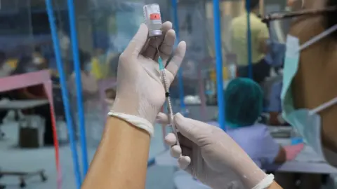 Getty Images Syringe with vaccine in lab